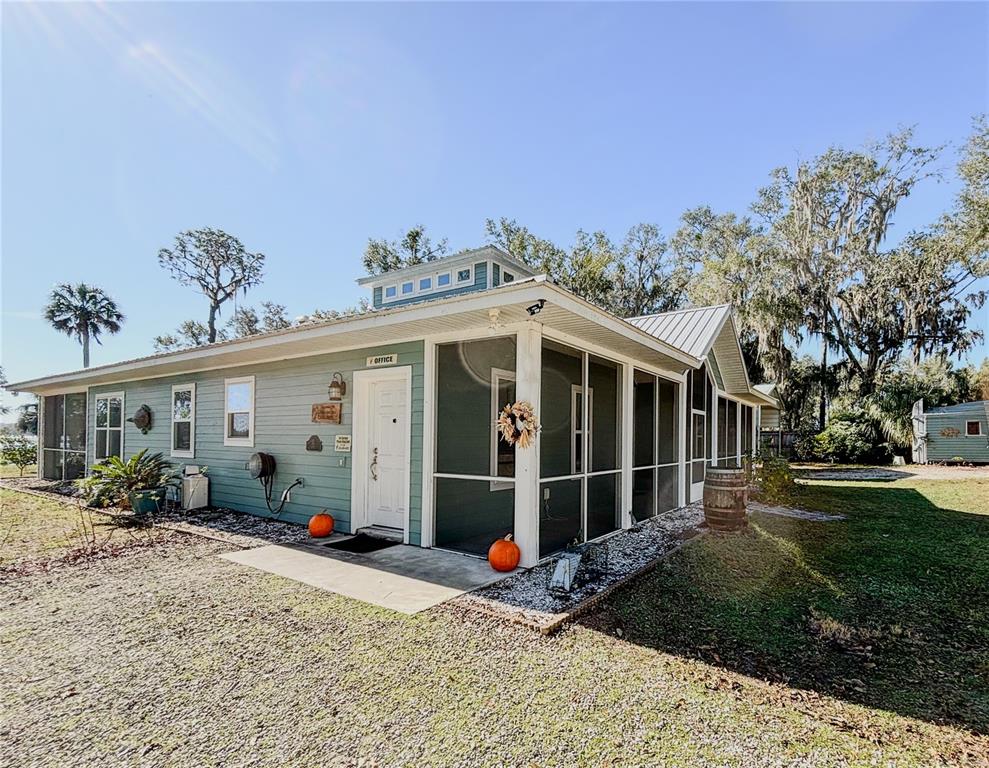 19151 Southeast 135th Court Dunnellon, FL 34431 - Photo 2 of 65 a view of a house with a garden