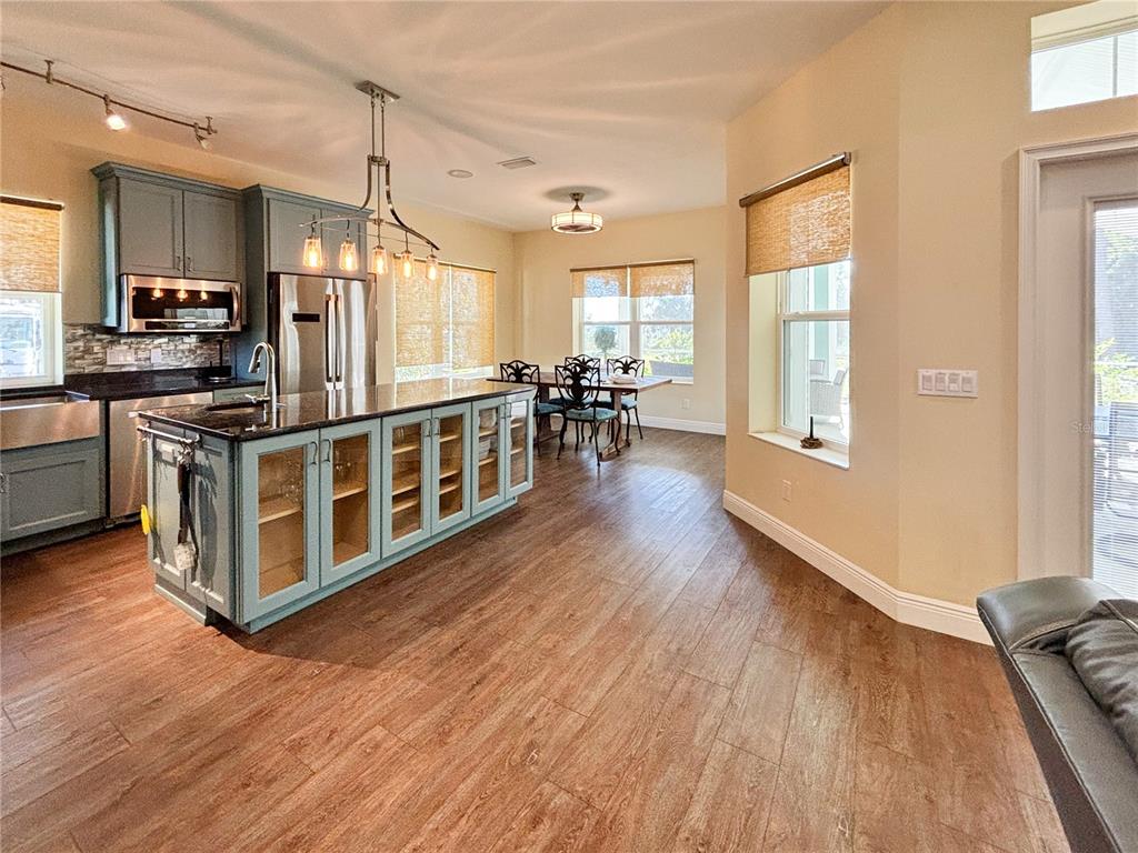 19151 Southeast 135th Court Dunnellon, FL 34431 - Photo 25 of 65 a kitchen with stainless steel appliances wooden floors and white walls
