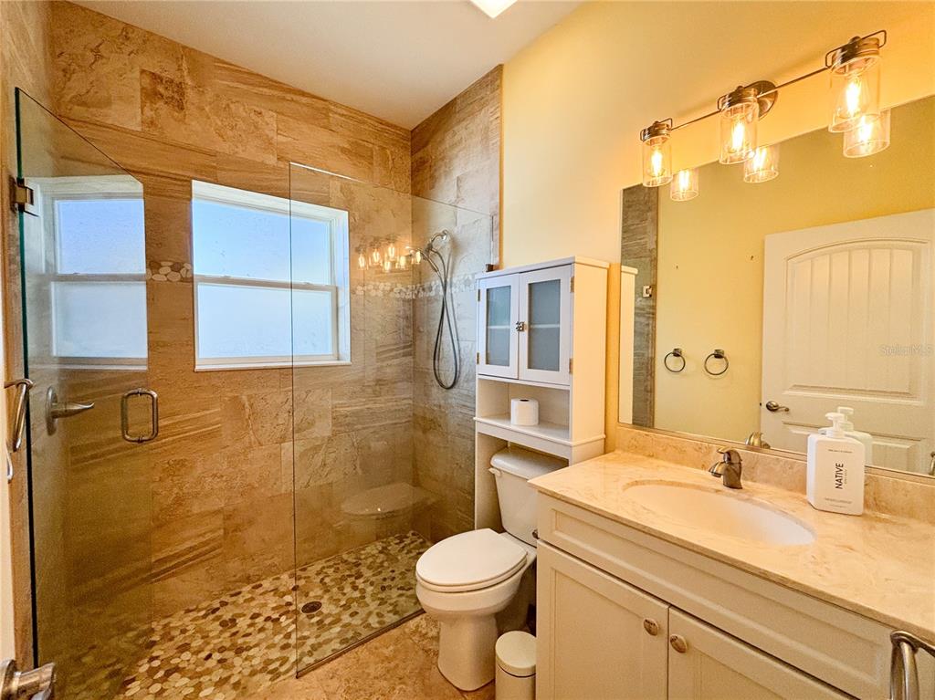 19151 Southeast 135th Court Dunnellon, FL 34431 - Photo 28 of 65 a bathroom with a sink toilet and shower