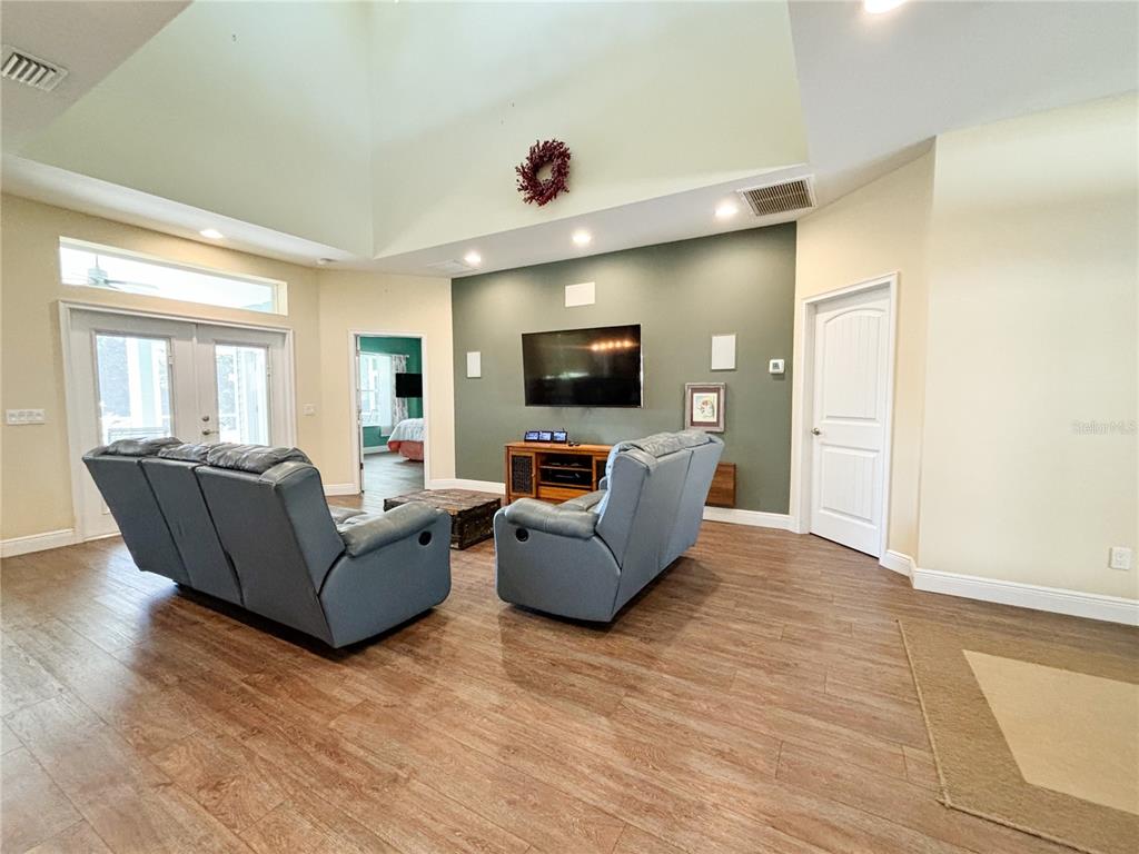 19151 Southeast 135th Court Dunnellon, FL 34431 - Photo 29 of 65 a living room with furniture and a flat screen tv