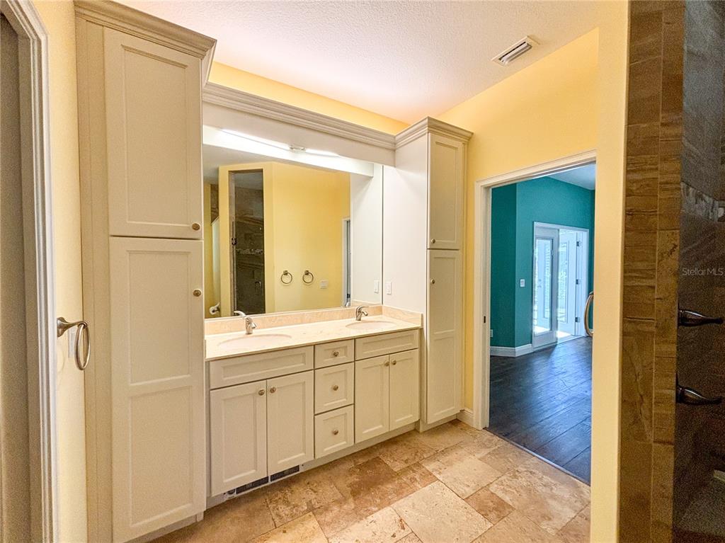 19151 Southeast 135th Court Dunnellon, FL 34431 - Photo 49 of 65 a bathroom with a sink and a mirror