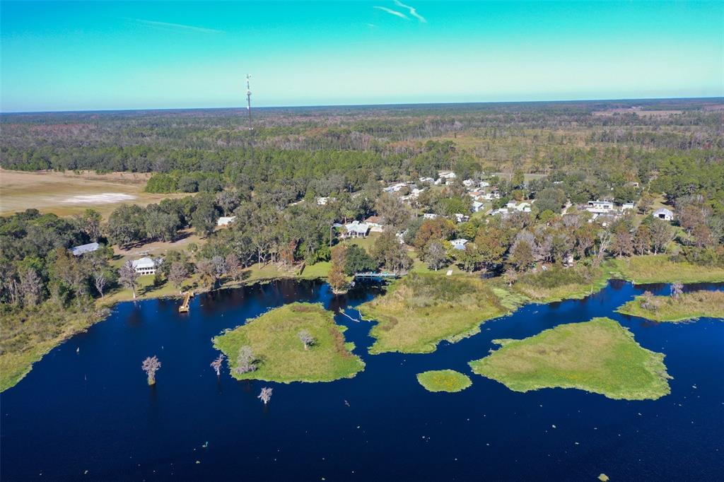 19151 Southeast 135th Court Dunnellon, FL 34431 - Photo 51 of 65 an aerial view of residential houses with outdoor space