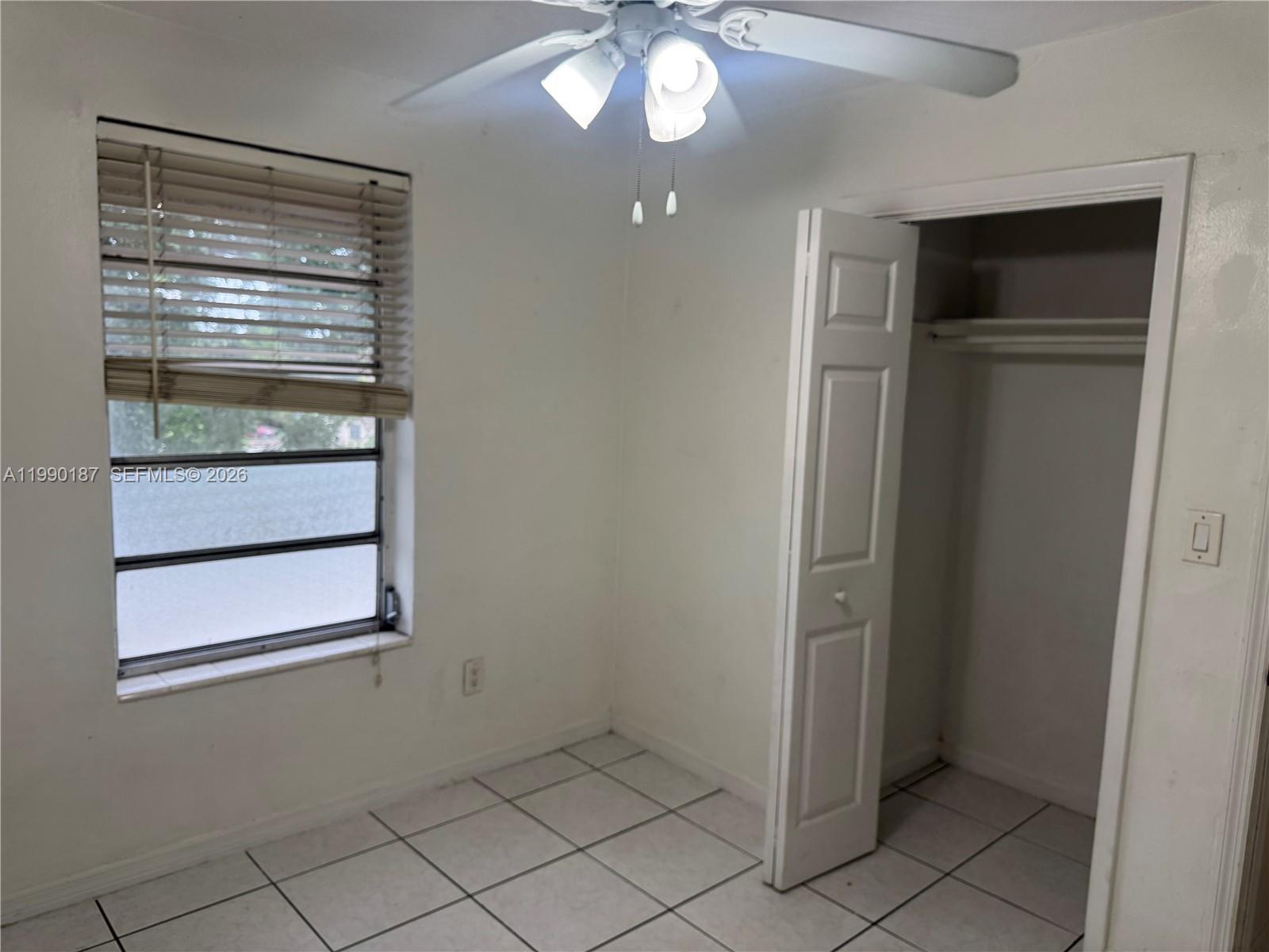 11 Southwest 32nd Avenue, Unit 4 Miami, FL 33135 - Photo 9 of 13 a view of an empty room with a fireplace