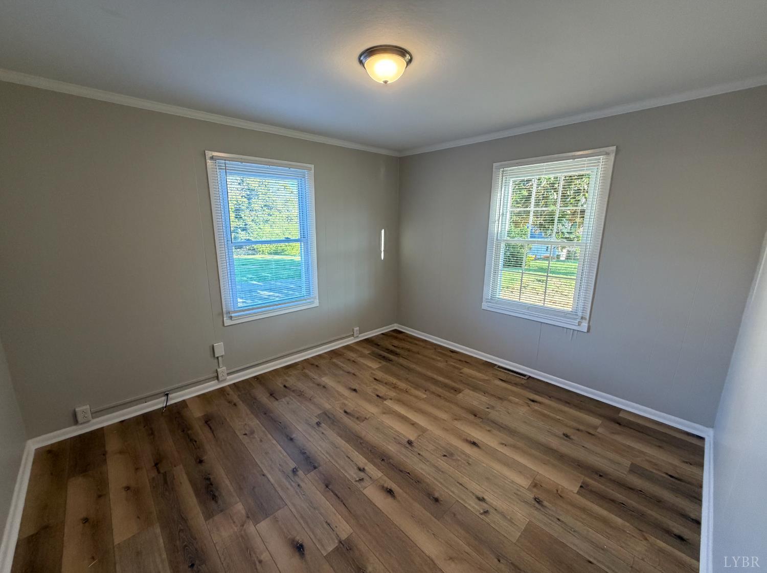 127 Campbell Street Madison Heights, VA 24572 - Photo 13 of 28 a view of empty room with wooden floor and fan