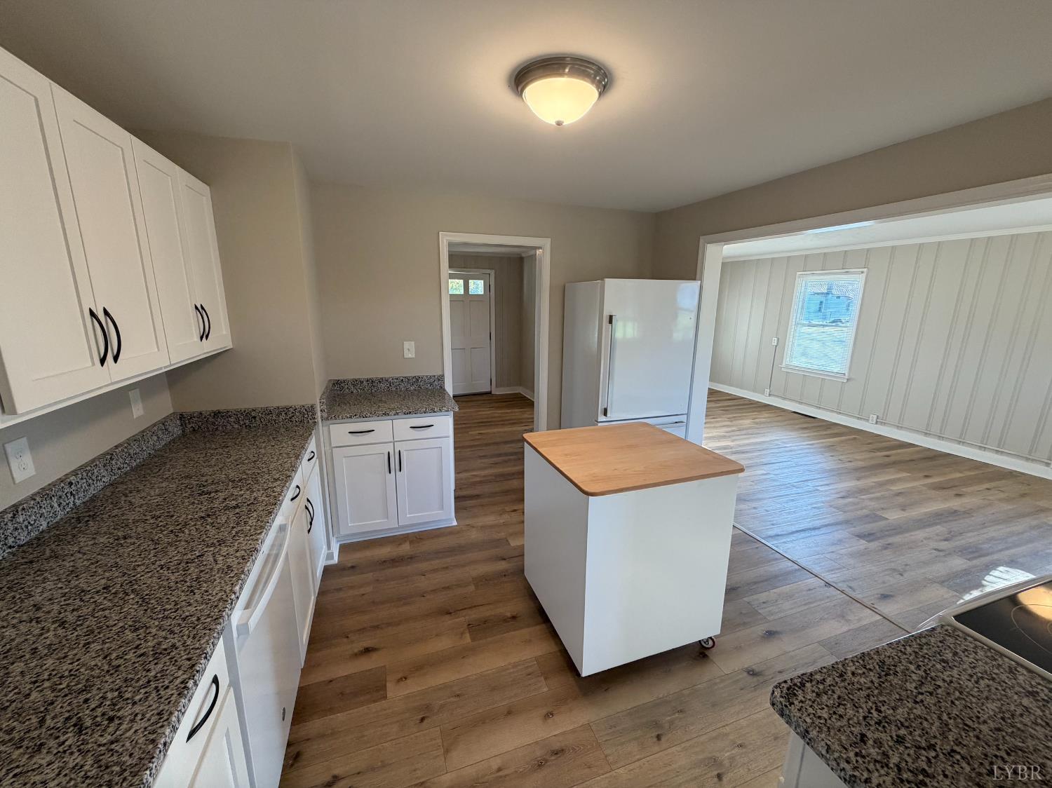 127 Campbell Street Madison Heights, VA 24572 - Photo 6 of 28 a kitchen with stainless steel appliances granite countertop a stove a sink and a refrigerator