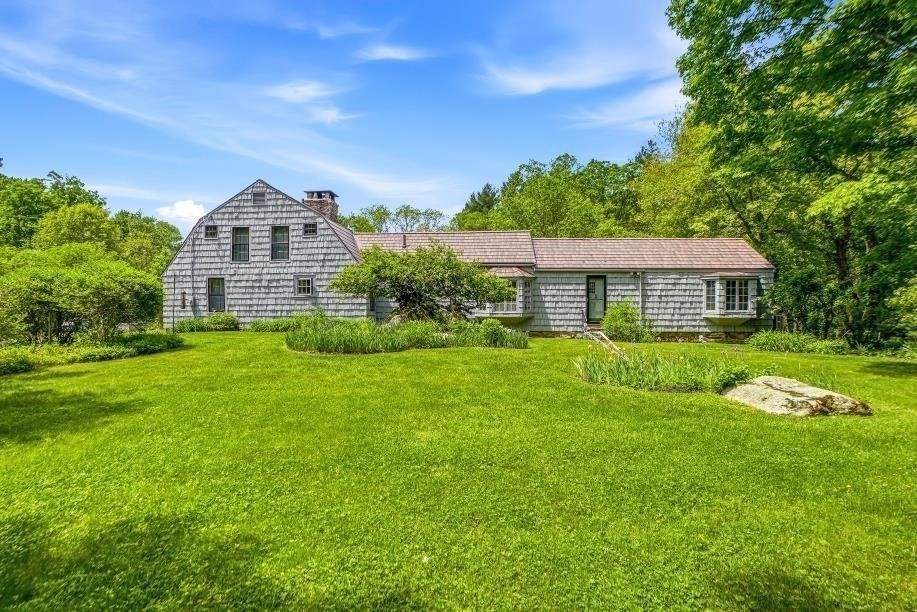 52 Elm Street Upton, MA 01568 - Photo 3 of 42 a front view of a house with a yard