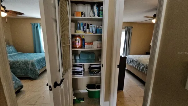 a bedroom with a bed and closet