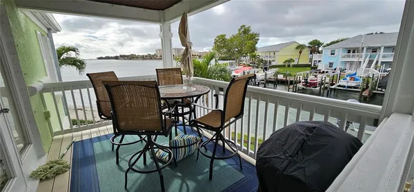a view of a chairs and table in patio