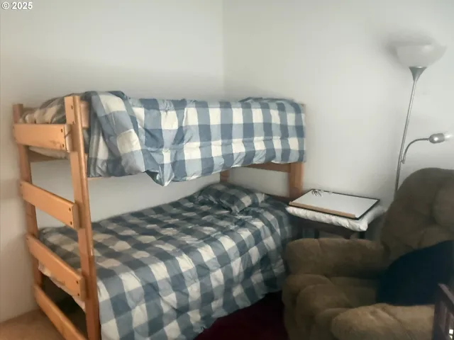 a bedroom with a bed and a couch
