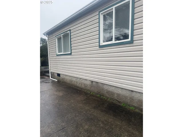 a view of a house with a yard and garage