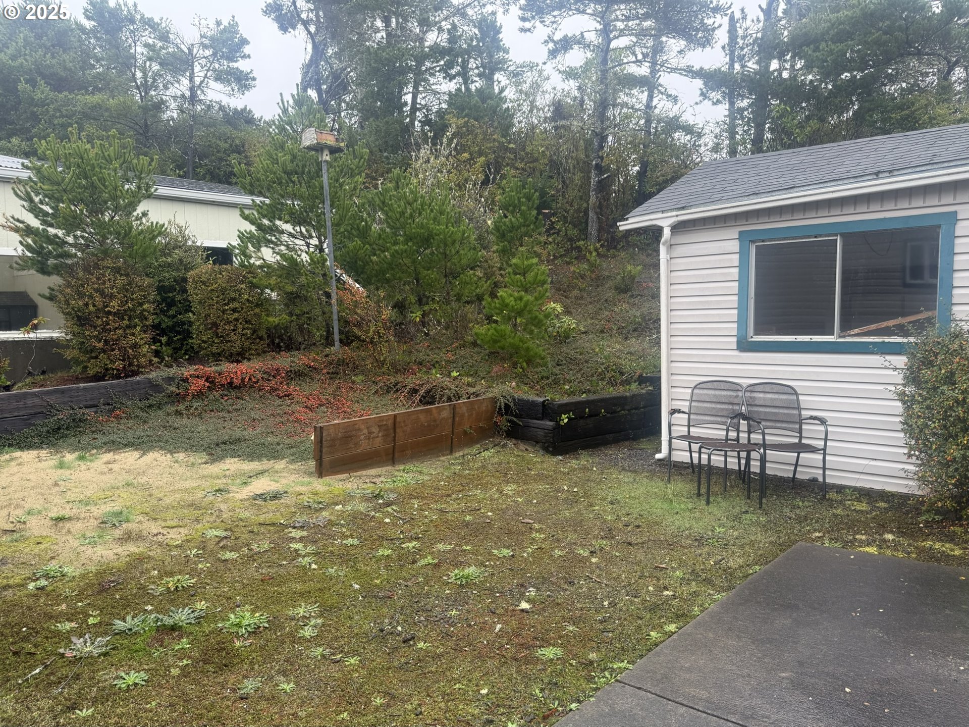 1601 Rhododendron Drive, Unit 654 Florence, OR 97439 - Photo 21 of 24 a view of a house with backyard