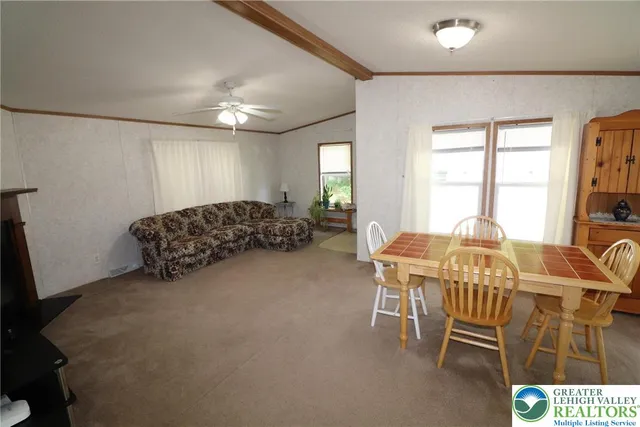 a view of a livingroom with furniture and window