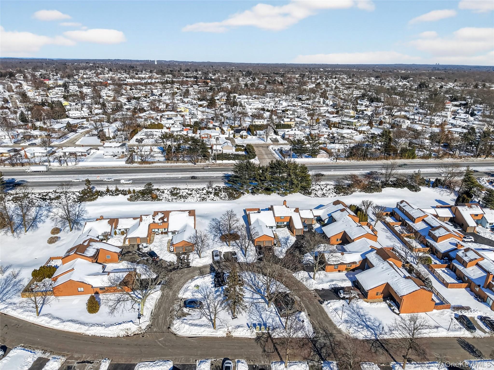 171 Melanie Way Commack, NY 11725 - Photo 25 of 29 Snowy aerial view with a residential view