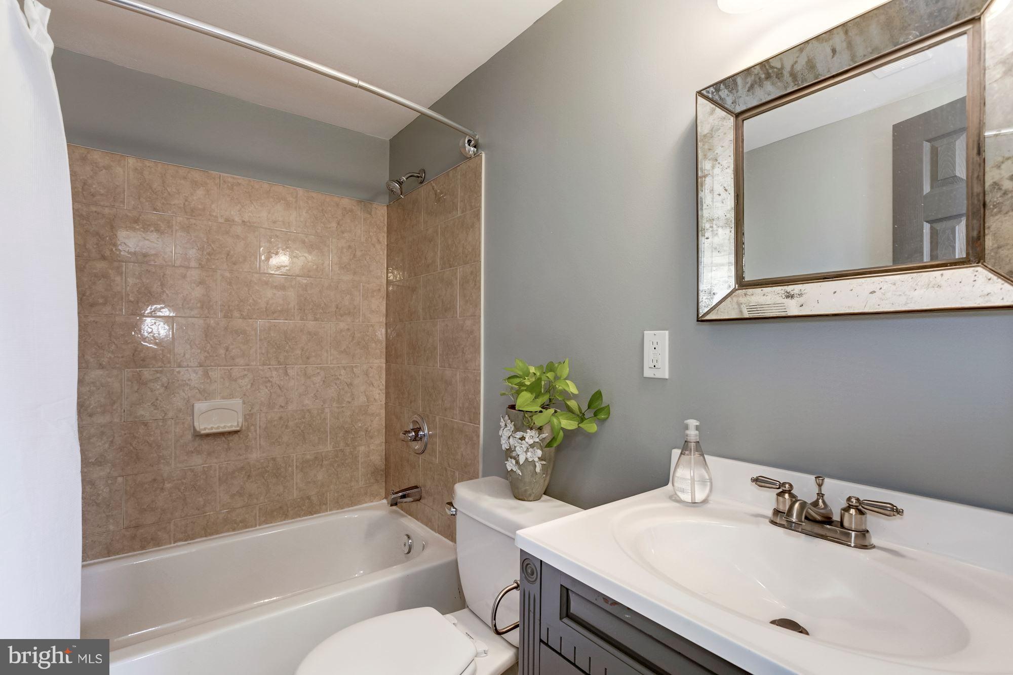 1377 K Street Southeast, Unit 2 Washington, DC 20003 - Photo 12 of 26 Full bath on main floor off entry landing