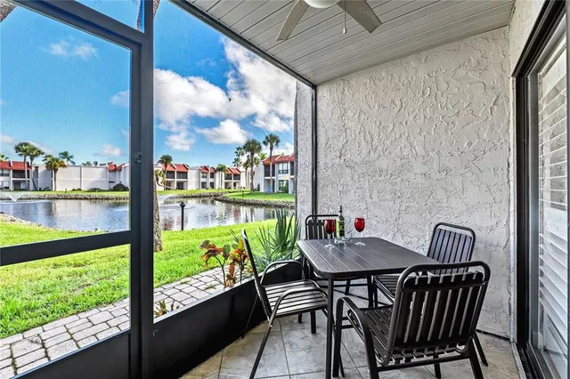 a view of a lake with a house in the background