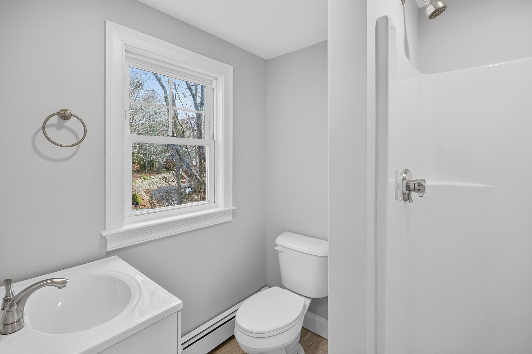 141 Braeside Road Falmouth, MA 02540 - Photo 12 of 47 a white toilet sitting next to a bathroom sink