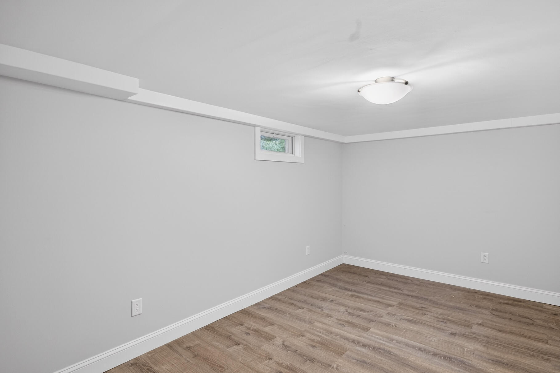 141 Braeside Road Falmouth, MA 02540 - Photo 28 of 47 a view of an empty room with wooden floor