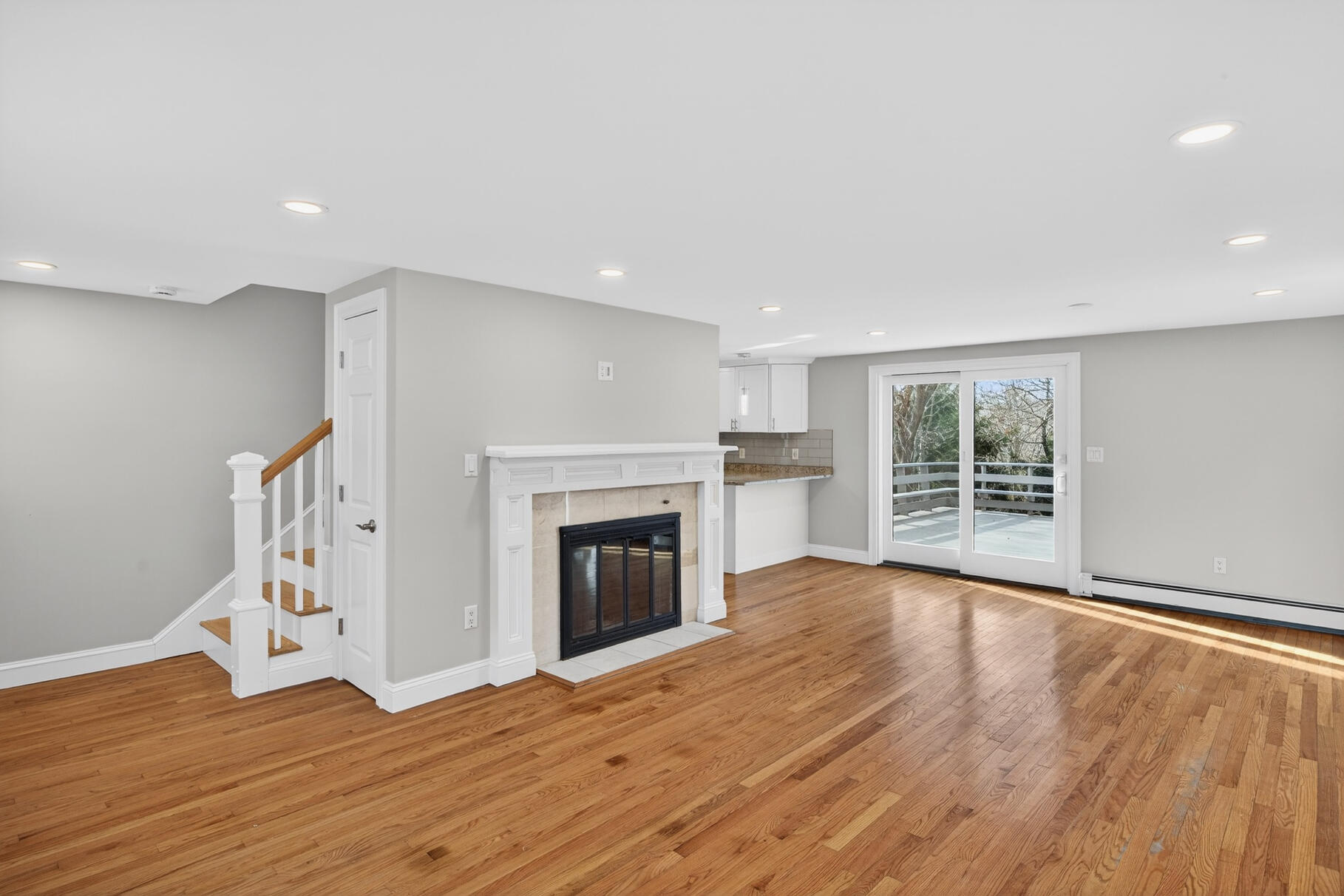 141 Braeside Road Falmouth, MA 02540 - Photo 3 of 47 a view of empty room with wooden floor and fireplace