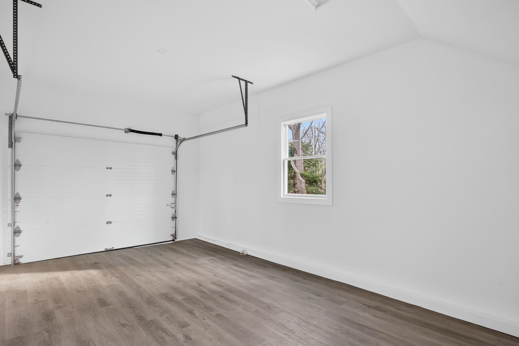 141 Braeside Road Falmouth, MA 02540 - Photo 33 of 47 an empty room with a window and wooden floor