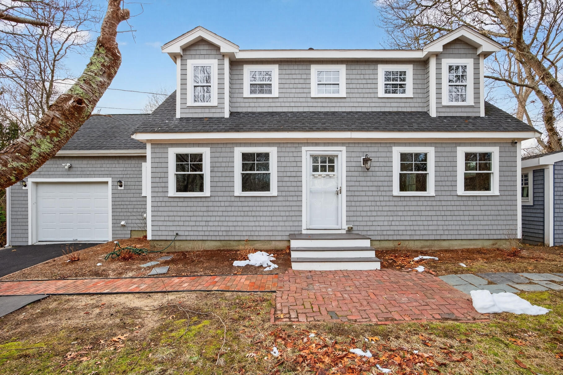 141 Braeside Road Falmouth, MA 02540 - Photo 39 of 47 a front view of a house with a road