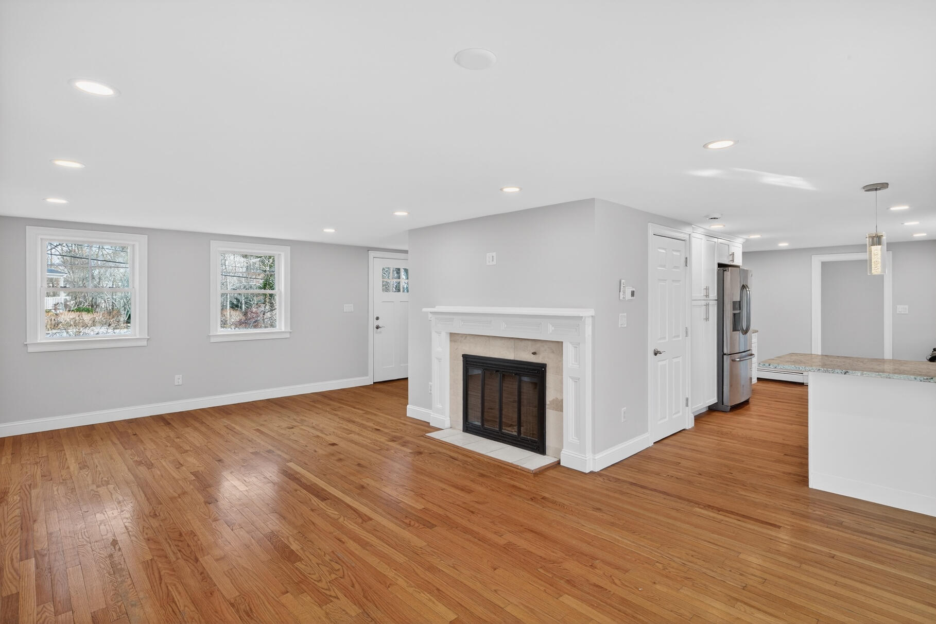 141 Braeside Road Falmouth, MA 02540 - Photo 4 of 47 a view of an empty room with wooden floor and a window