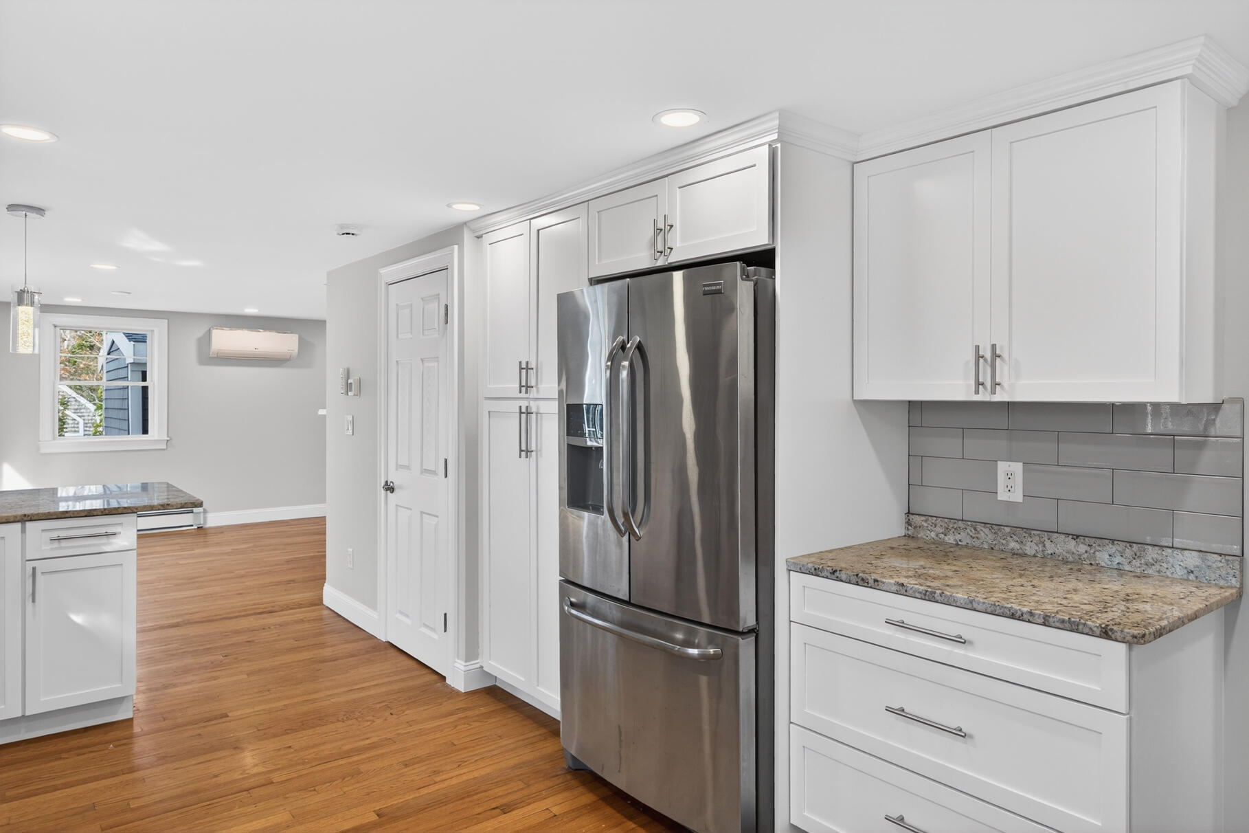 141 Braeside Road Falmouth, MA 02540 - Photo 7 of 47 a kitchen with granite countertop a refrigerator and a stove top oven