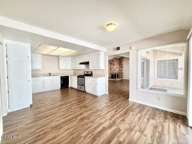 a view of kitchen with wooden floor and window