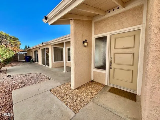 a view of a house with a door and balcony