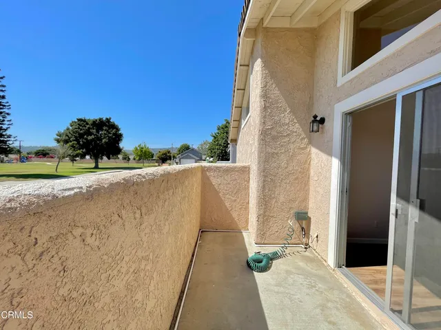 a pathway of a house with a yard