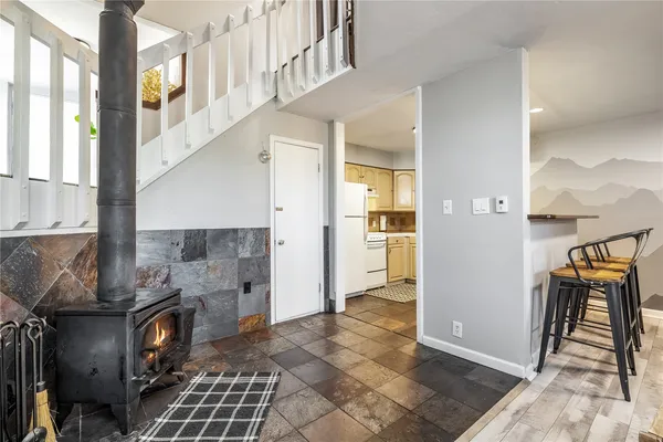 a view of a livingroom with furniture and front door