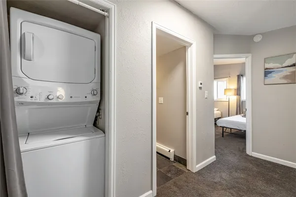 a view of bathroom with a toilet and a mirror