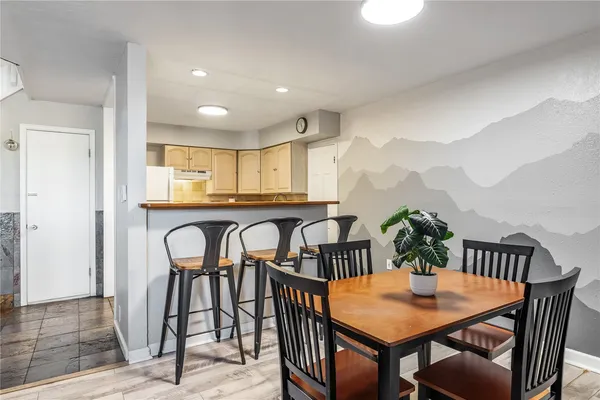 a dining room with furniture and window