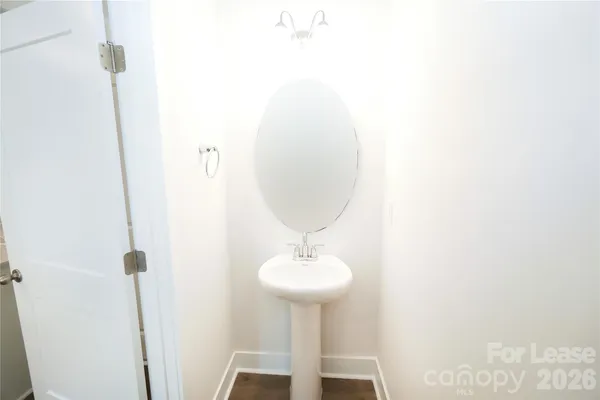 a bathroom with a sink a mirror and a shower