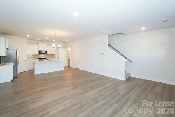 a view of kitchen with wooden floor