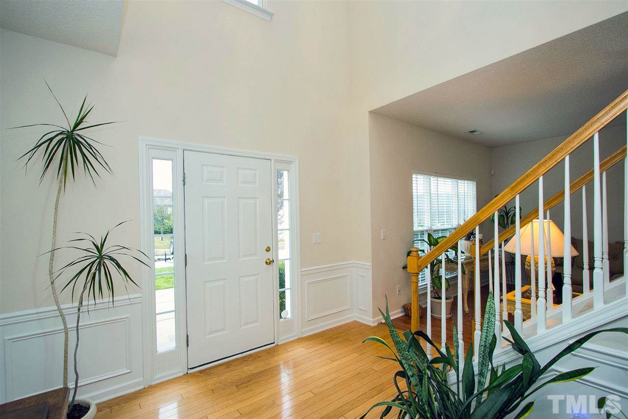 405 Grassy Point Road Apex, NC 27502 - Photo 2 of 25 Gorgeous Hardwoods greet you at the door...