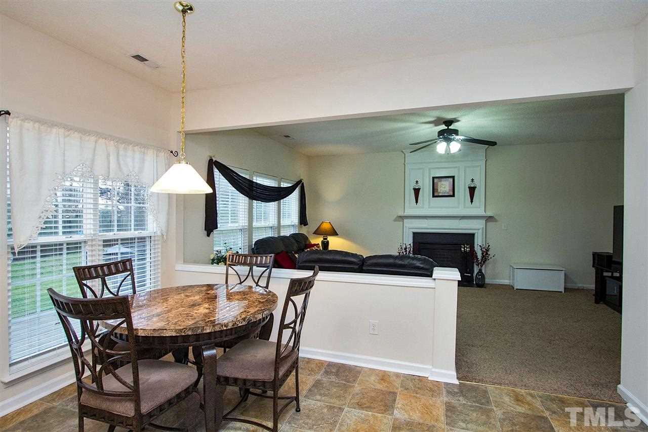 405 Grassy Point Road Apex, NC 27502 - Photo 10 of 25 Lots of windows make for a pleasant place for morning coffee or dinner with family ...
