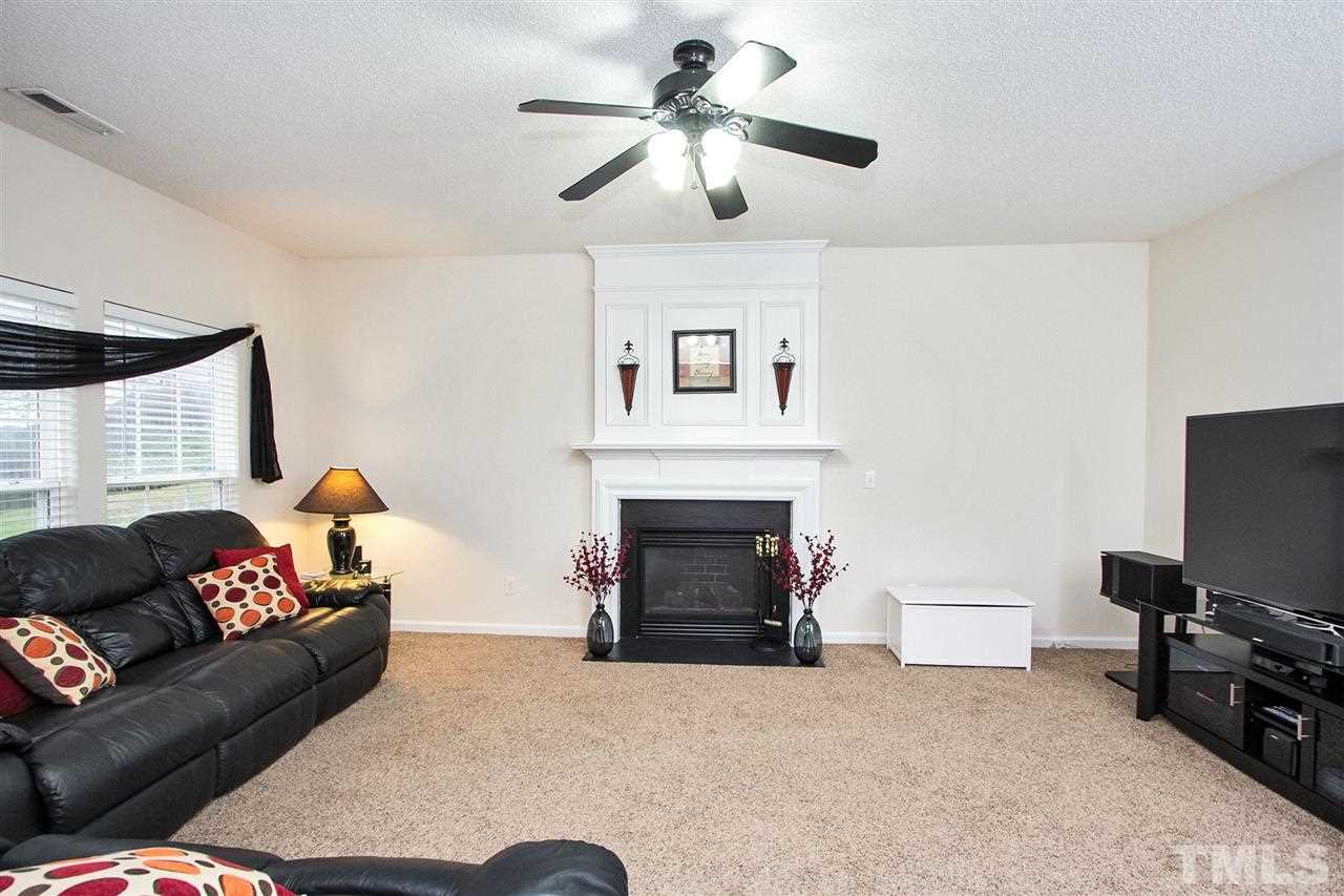 405 Grassy Point Road Apex, NC 27502 - Photo 11 of 25 Elegant fireplace anchors the inviting Family Room...