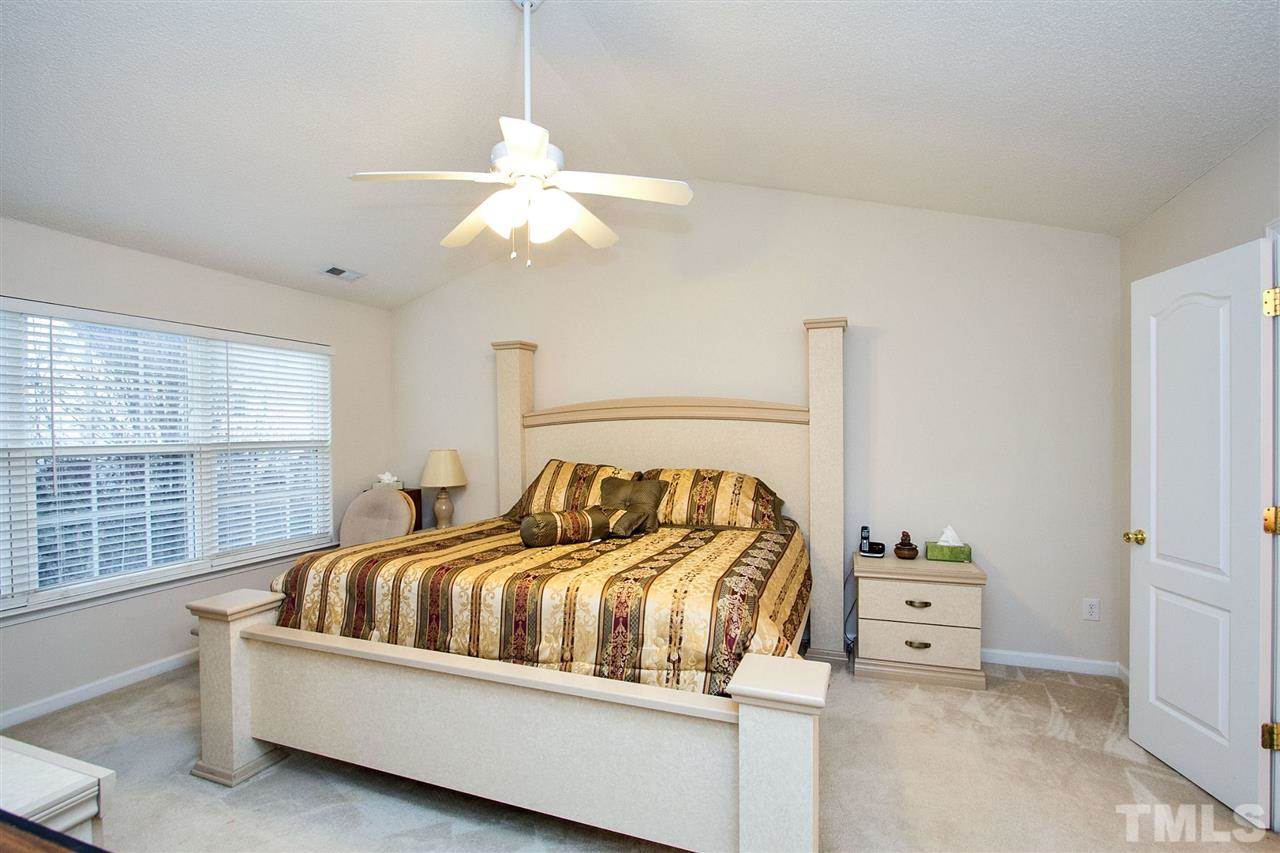 405 Grassy Point Road Apex, NC 27502 - Photo 14 of 25 Vaulted ceiling, over sized windows, bright and inviting ...