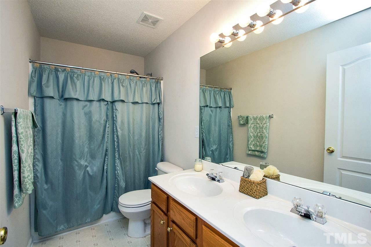 405 Grassy Point Road Apex, NC 27502 - Photo 22 of 25 Double vanity is nice and gives good storage below ...