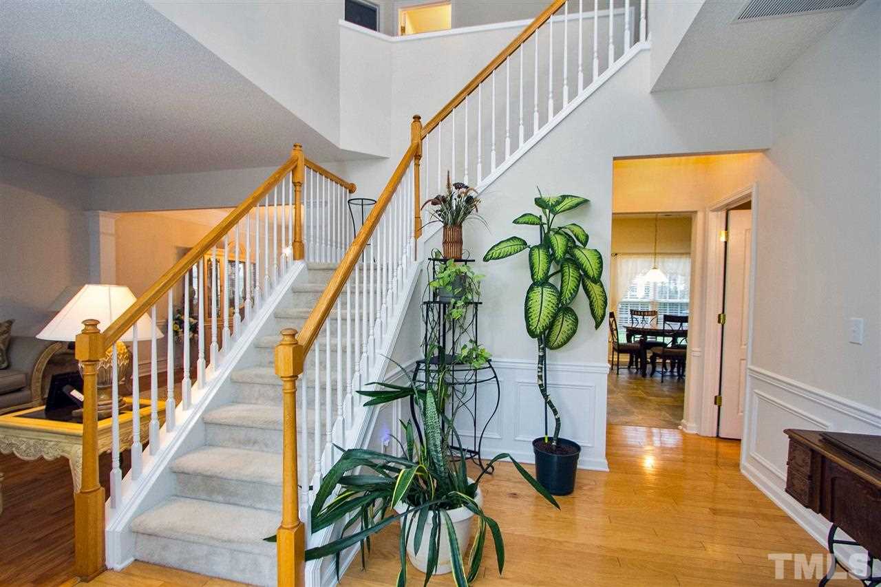405 Grassy Point Road Apex, NC 27502 - Photo 4 of 25 What a grand staircase!