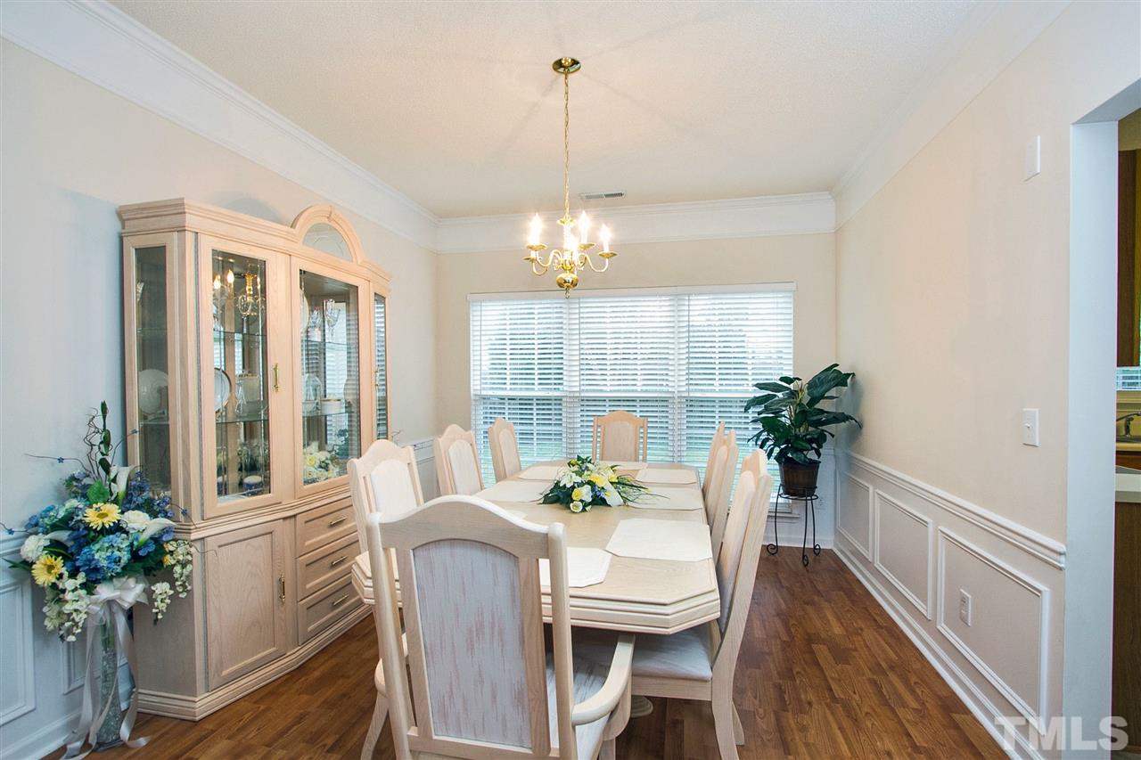 405 Grassy Point Road Apex, NC 27502 - Photo 7 of 25 Wainscoting, elegant trim, nice over sized window ... just beautiful!