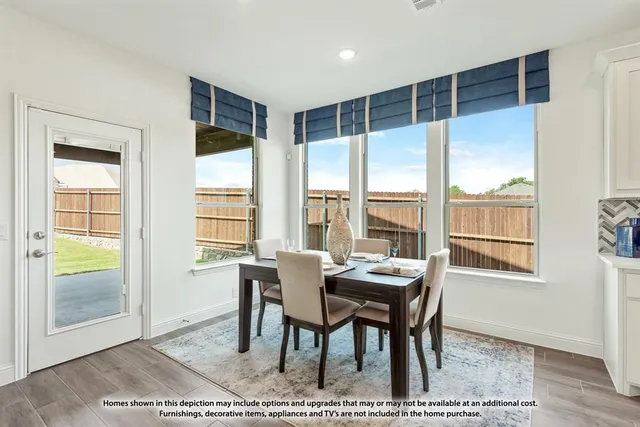 a dining room with wooden floor and a floor to ceiling window