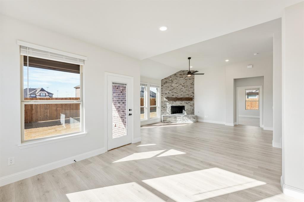 913 Firewood Way Anna, TX 75409 - Photo 15 of 40 a living room with furniture and a fireplace