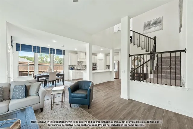 a spacious bedroom with a bed couch and a large window