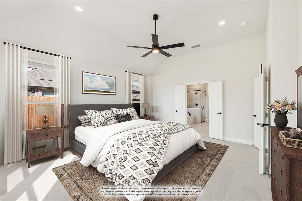 913 Firewood Way Anna, TX 75409 - Photo 22 of 40 a bedroom with a large bed and a chandelier