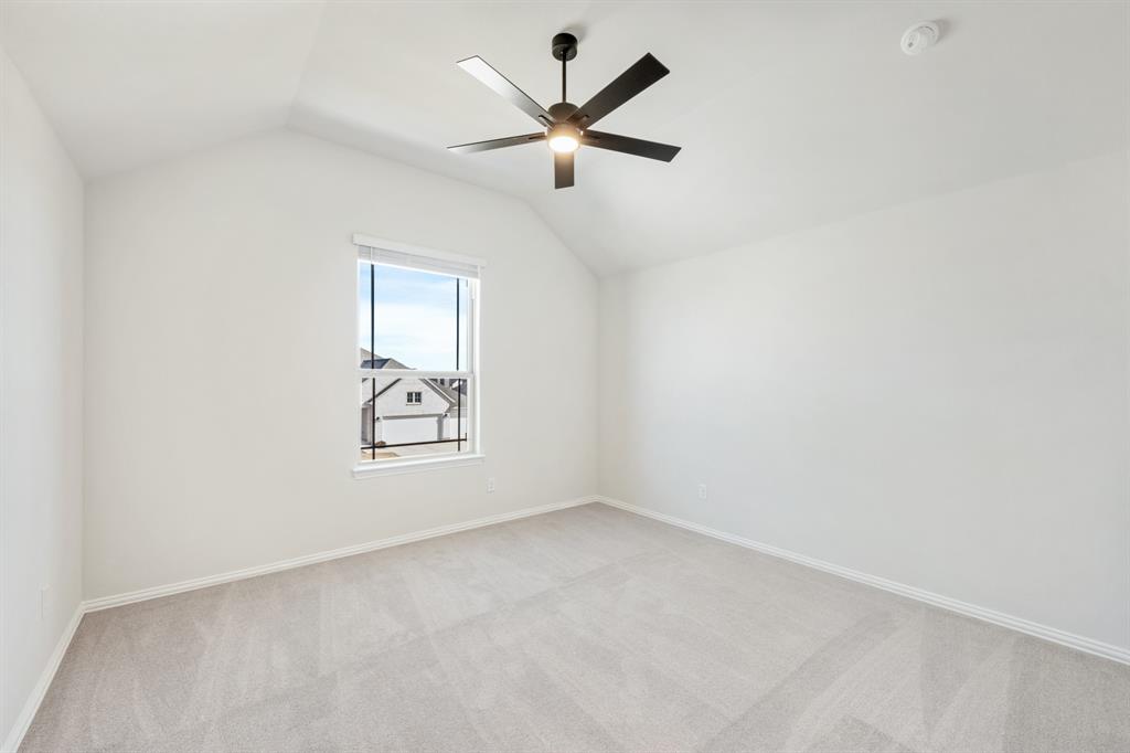 913 Firewood Way Anna, TX 75409 - Photo 31 of 40 an empty room with window and ceiling fan