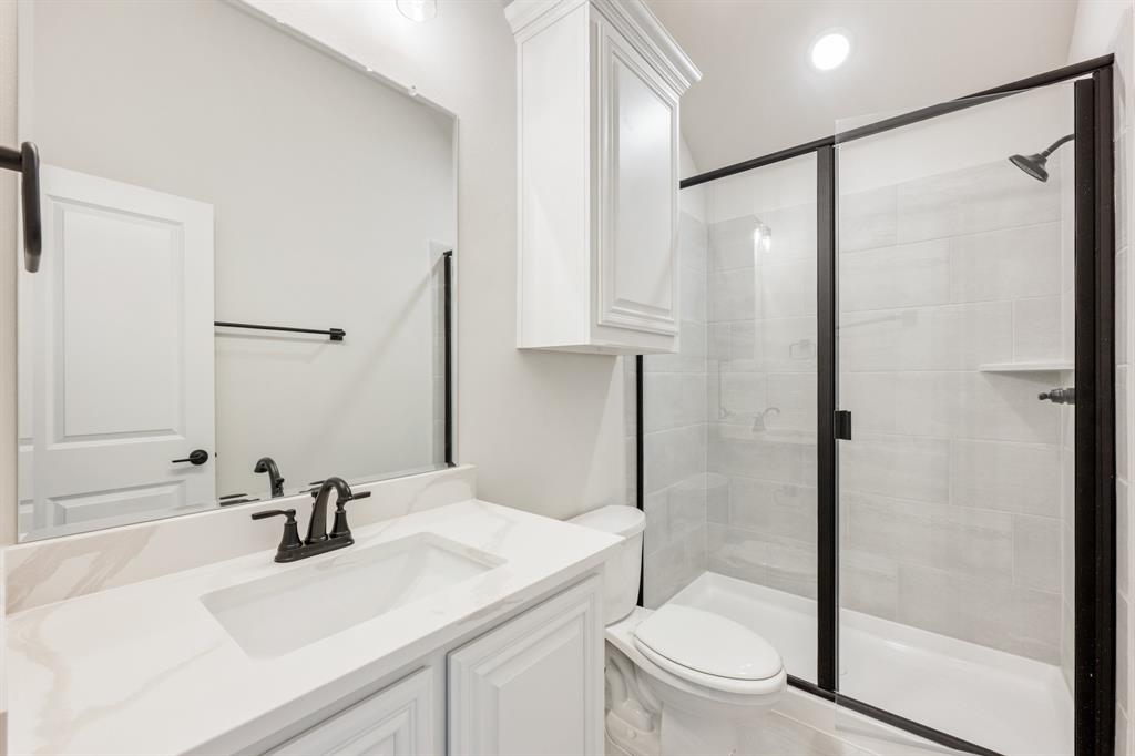 913 Firewood Way Anna, TX 75409 - Photo 35 of 40 a bathroom with a sink toilet and shower