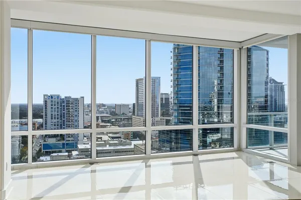 a room with a large window and view of living room