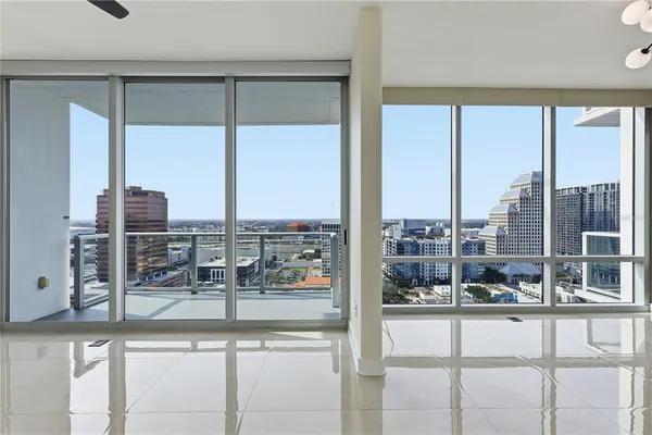 a bathroom with a granite countertop sink a toilet and a mirror