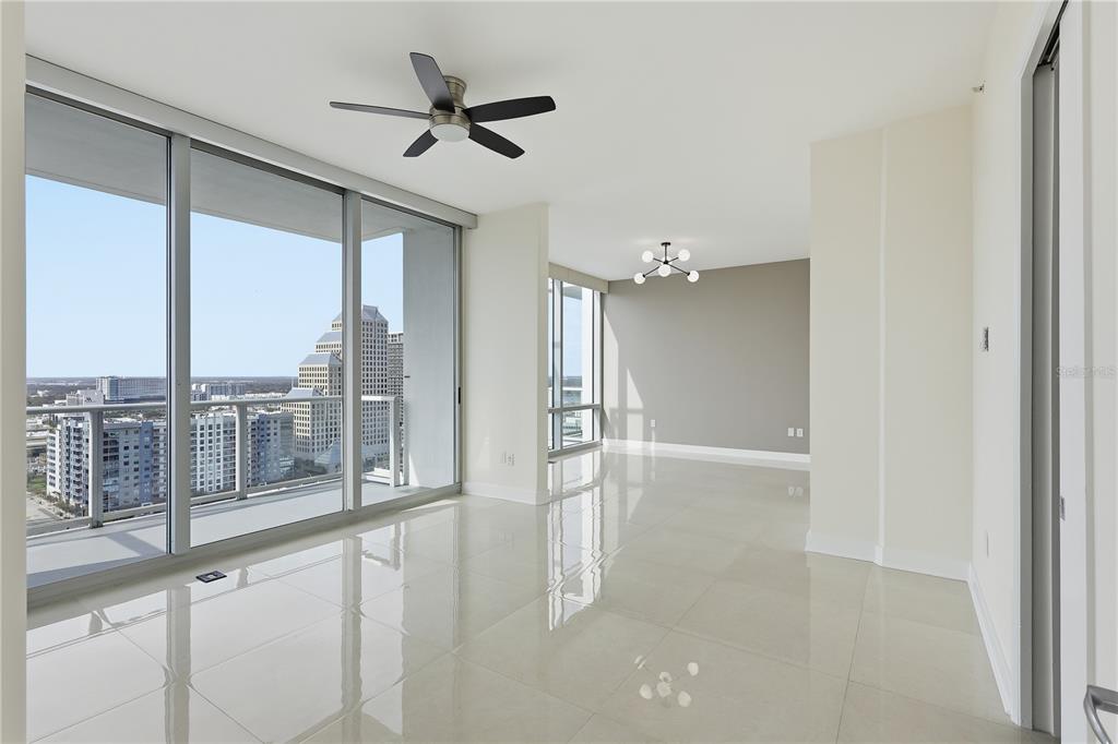 150 East Robinson Street, Unit 2002 Orlando, FL 32801 - Photo 24 of 41 a view of a livingroom with a ceiling fan and window